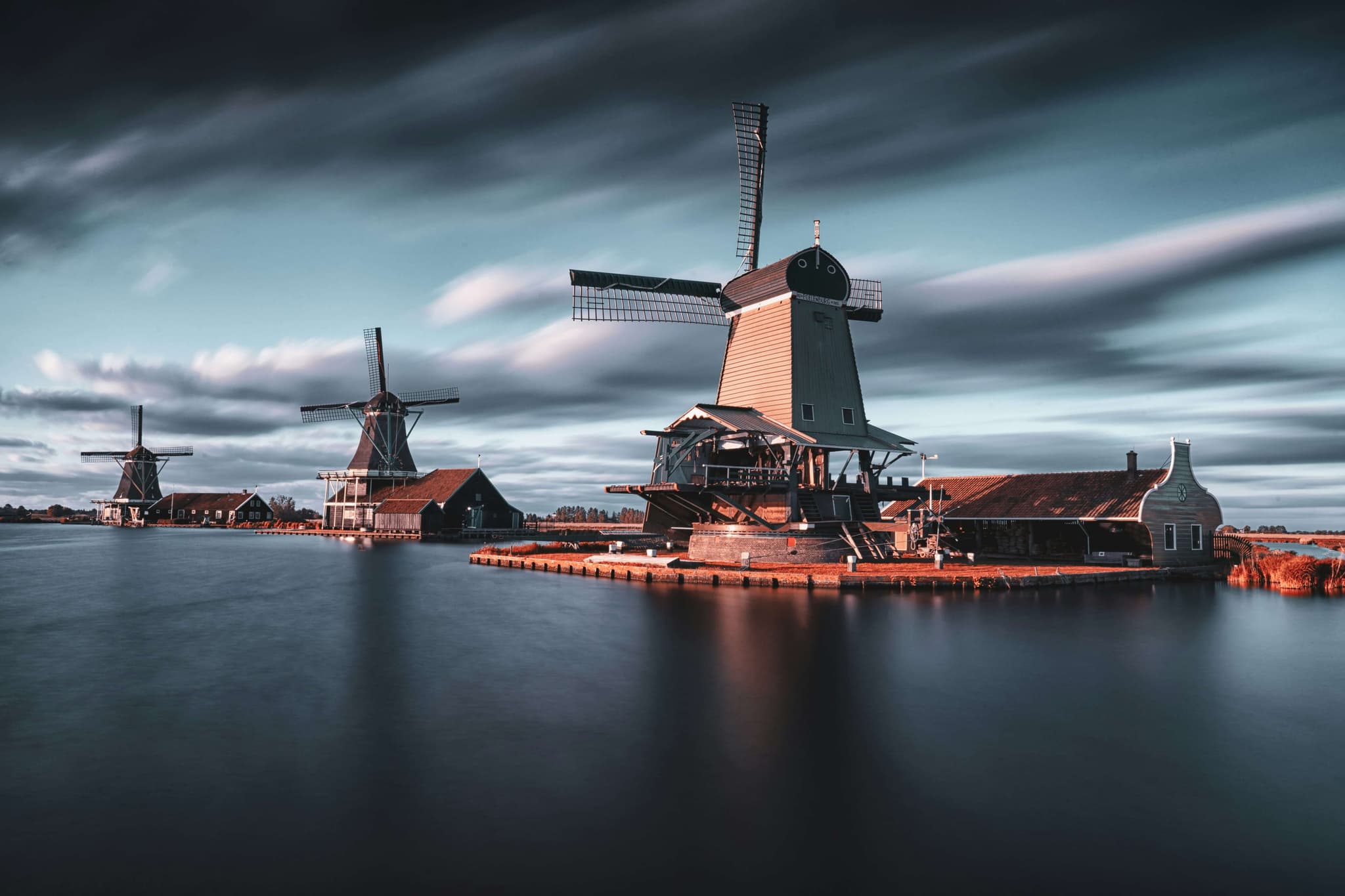 Image of Dutch windmills over the river